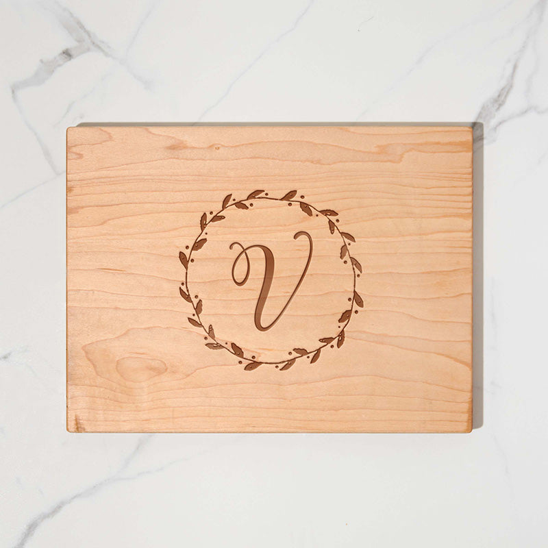 https://www.personalizedgallery.com/cdn/shop/products/Custom-maple-cutting-board-WREATH-INTIAL-V_004f7268-afa7-49be-a649-7788fc0c3ba1_2048x.jpg?v=1650471288