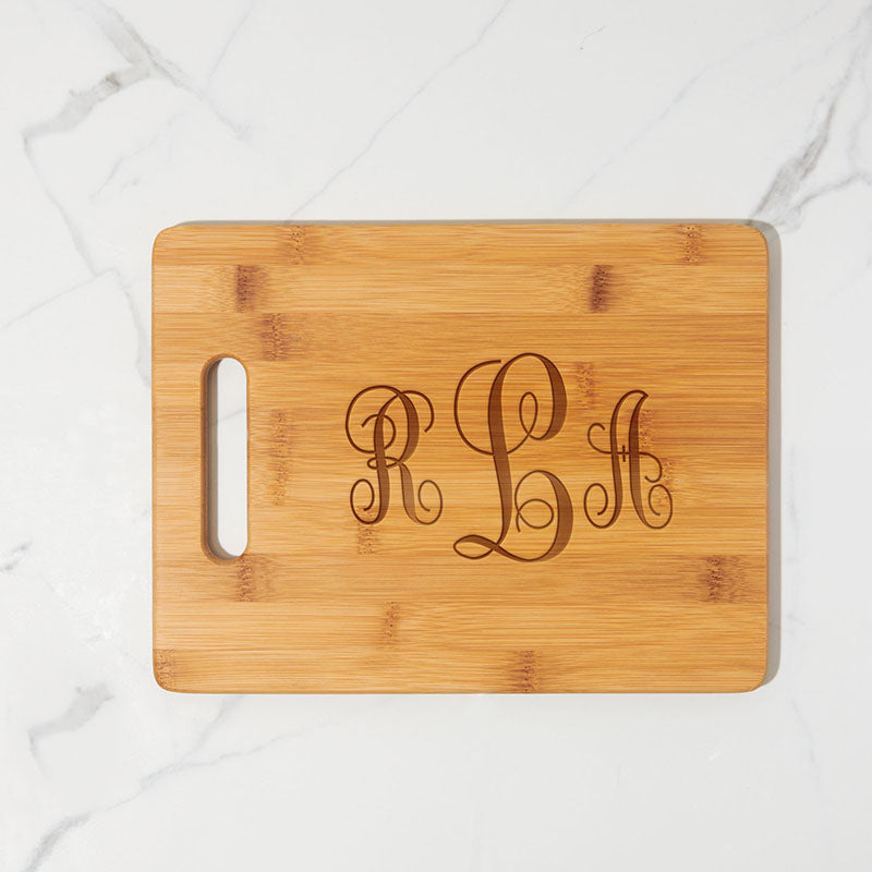 https://www.personalizedgallery.com/cdn/shop/products/Engraved-Bamboo-cutting-board-Monogram-Vines_2048x.jpg?v=1648757513