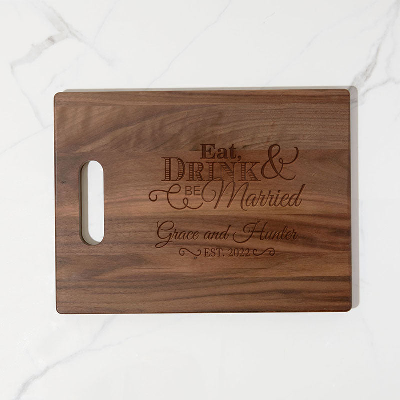 https://www.personalizedgallery.com/cdn/shop/products/engraved-walnut-cutting-board-Eat-Drink_7036d17c-0d3a-4cc4-9e5e-60ea456f1473_2048x.jpg?v=1649805268