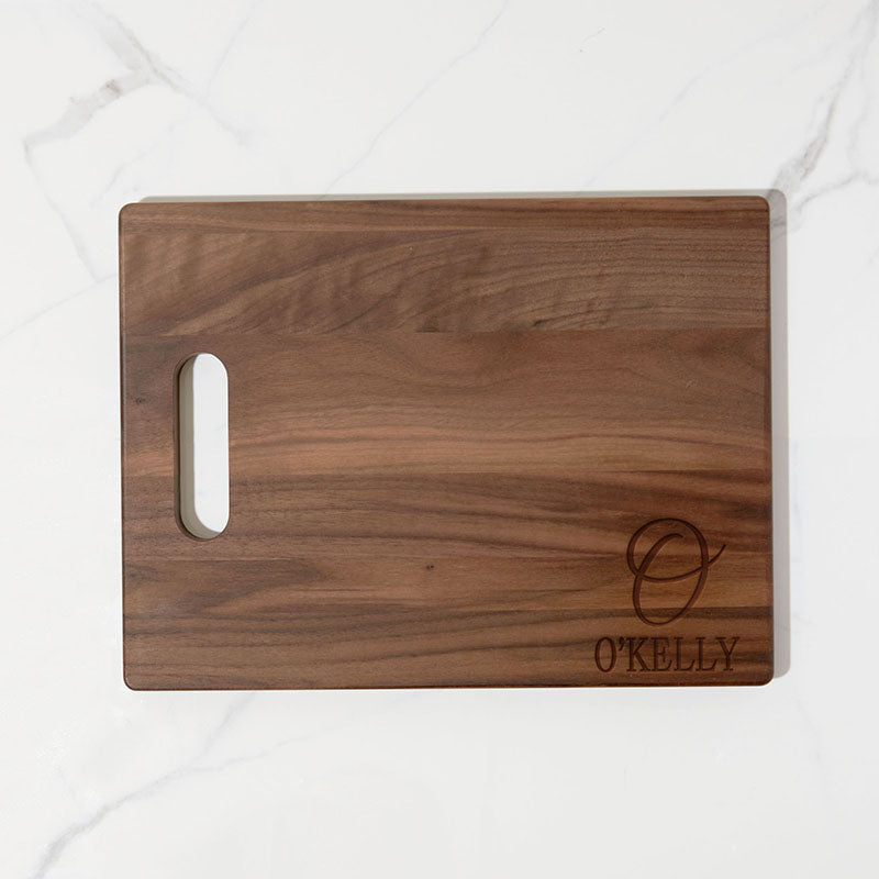 https://www.personalizedgallery.com/cdn/shop/products/engraved-walnut-cutting-board-Initial-and-Name_2048x.jpg?v=1649805268