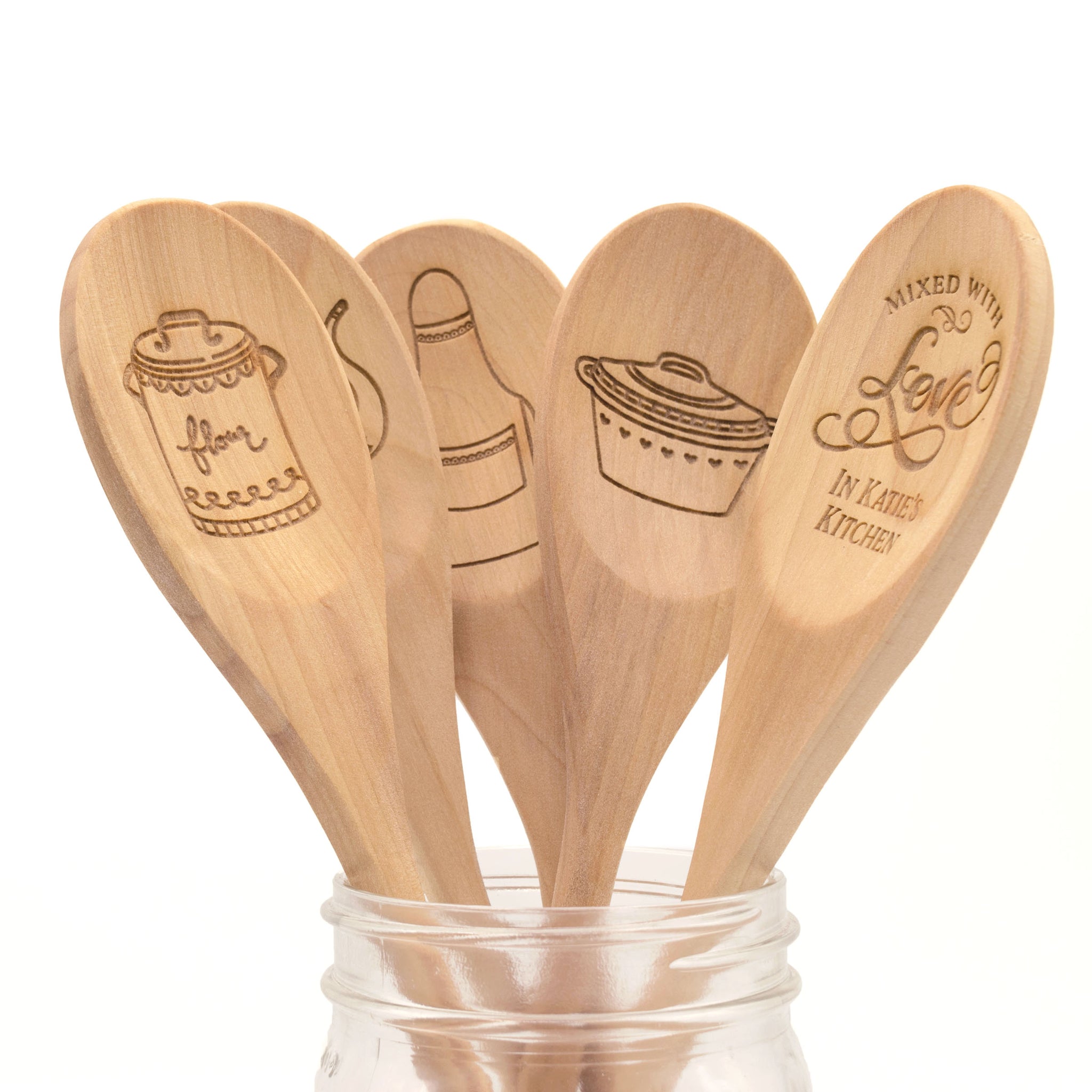 Row of assorted wooden kitchen utensils Stock Photo by ©oocoskun 68950495